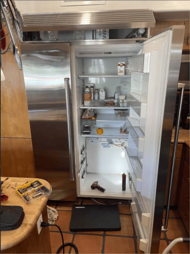 Sub-Zero service and maintenance in Tampa — Open Sub-Zero column refrigerator serviced with the food left in place during a Palma Ceia visit