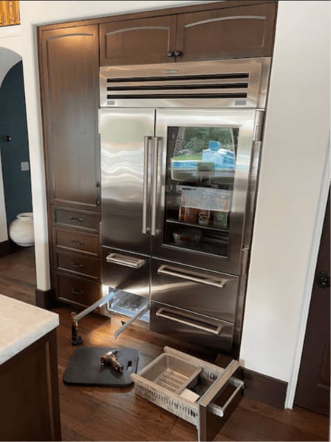 Sub-Zero repair near me in Tampa — Sub-Zero BI-48SD glass-door with the ice maker drawer pulled in a Westshore home